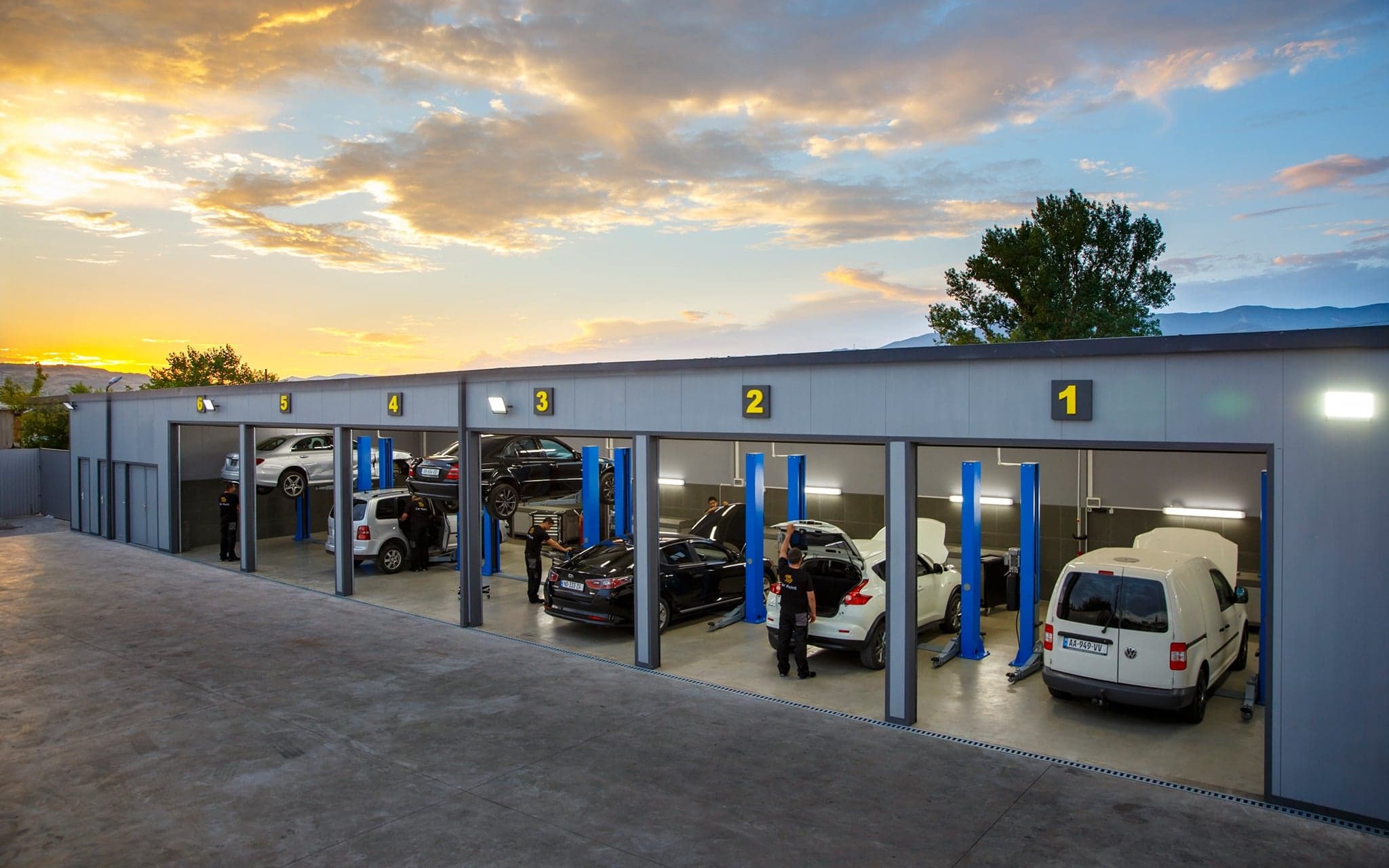 The CarPoint workshop in Tbilisi with six service bays and vehicles being repaired